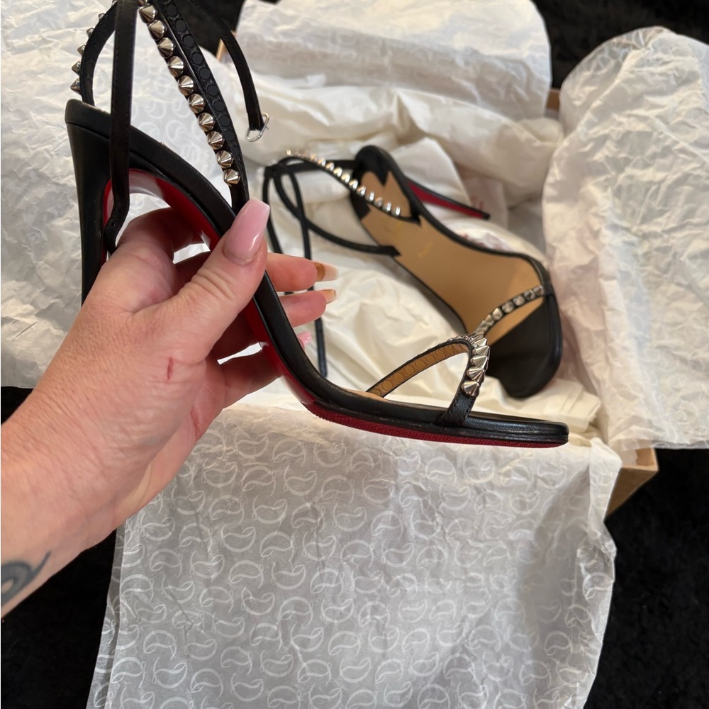 Christian Louboutin black studded so me open toe heels.